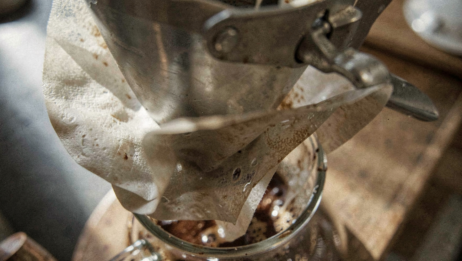 Close-up of a coffee bag label showing roast date, origin and tasting note text